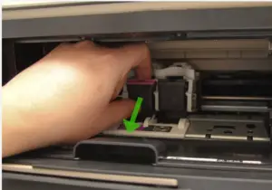 Open the ink tray in the printer's center